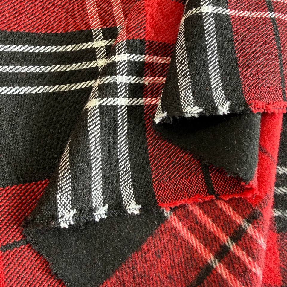 Red and black plaid fabric close-up tartan pattern textile