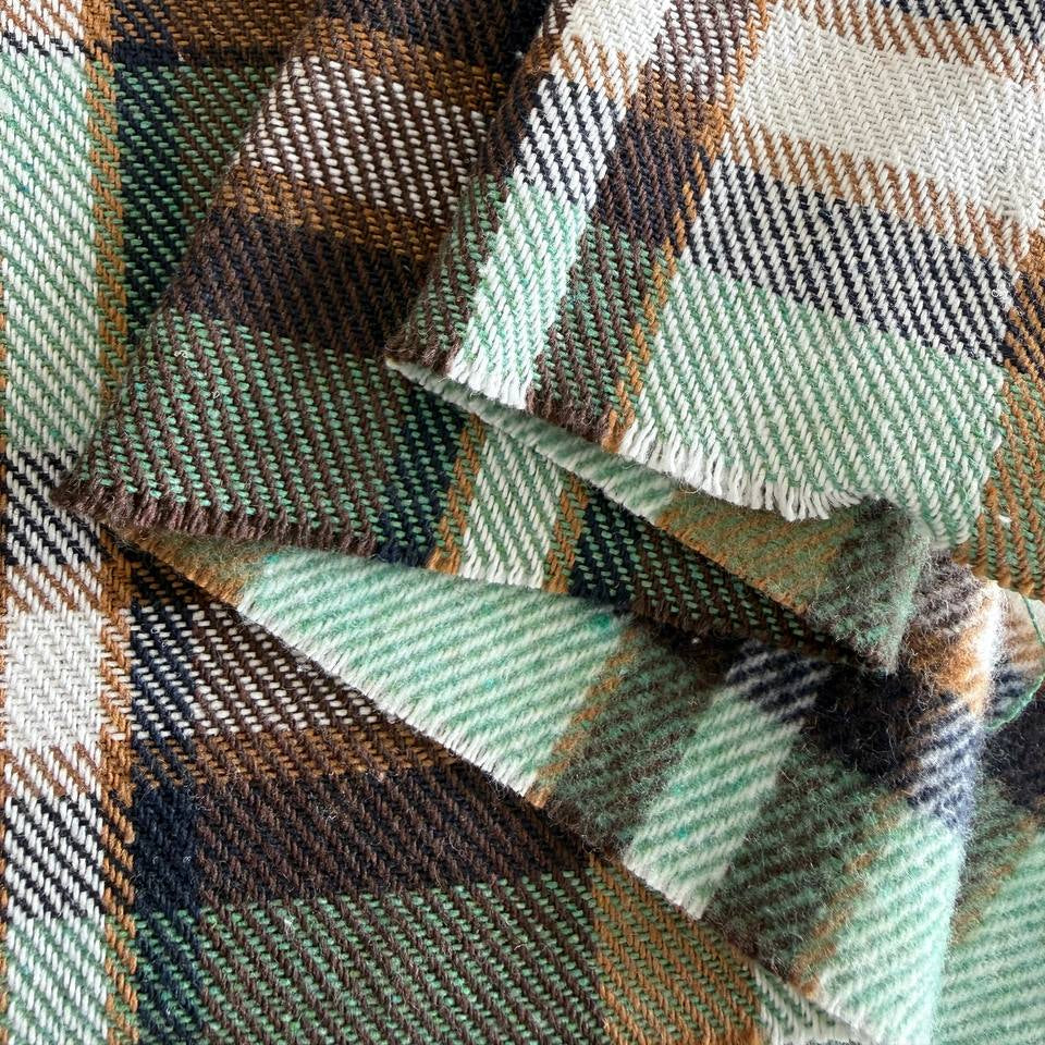 Green brown plaid yarn dyed fabric fiber composition label
