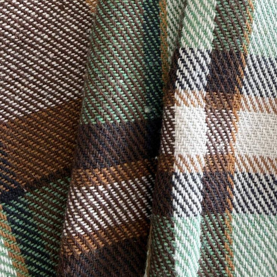 Green brown plaid yarn dyed fabric fiber composition label