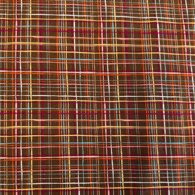 Brown quilting cotton featuring an intricate woven line plaid design in cocoa, orange, pink, blue, gold, and cream from the Things Above collection by Moda Fabrics.
