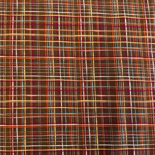 Brown quilting cotton featuring an intricate woven line plaid design in cocoa, orange, pink, blue, gold, and cream from the Things Above collection by Moda Fabrics.