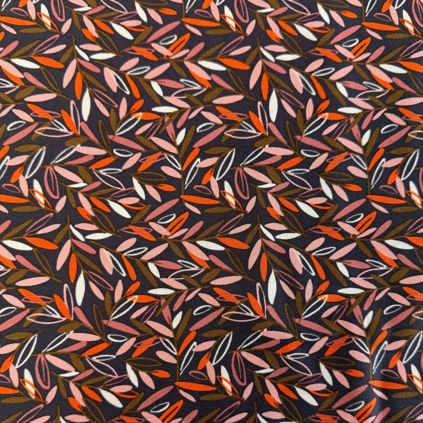 Modern quilting cotton fabric featuring an all-over scattered leaf print in blush pink, orange, cream, and olive tones on a charcoal grey background from the Things Above collection by Fancy That Design House for Moda Fabrics.