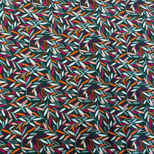 Modern quilting cotton fabric featuring an all-over scattered leaf print in teal, blush pink, orange, aqua, and magenta tones on a deep teal background from the Things Above collection by Fancy That Design House for Moda Fabrics.
