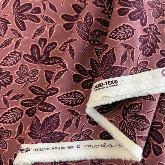 Dusty rose quilting cotton featuring an allover leaf print from Moda Fabrics' Foraged, Found & Hand Me Down collection.