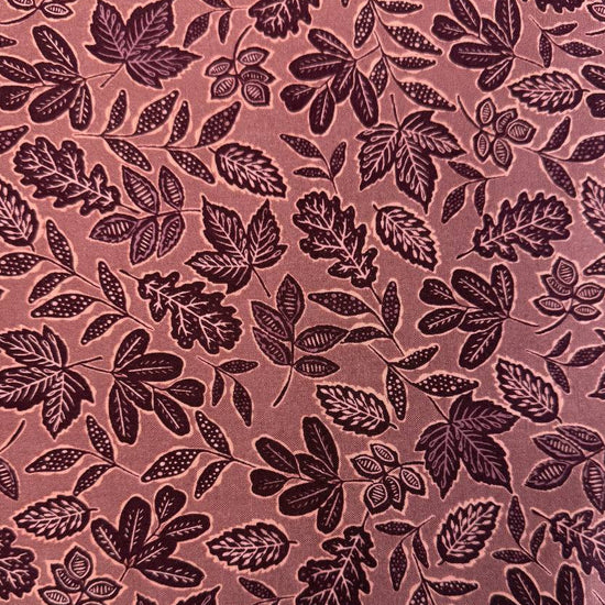 Dusty rose quilting cotton featuring an allover leaf print from Moda Fabrics' Foraged, Found & Hand Me Down collection.