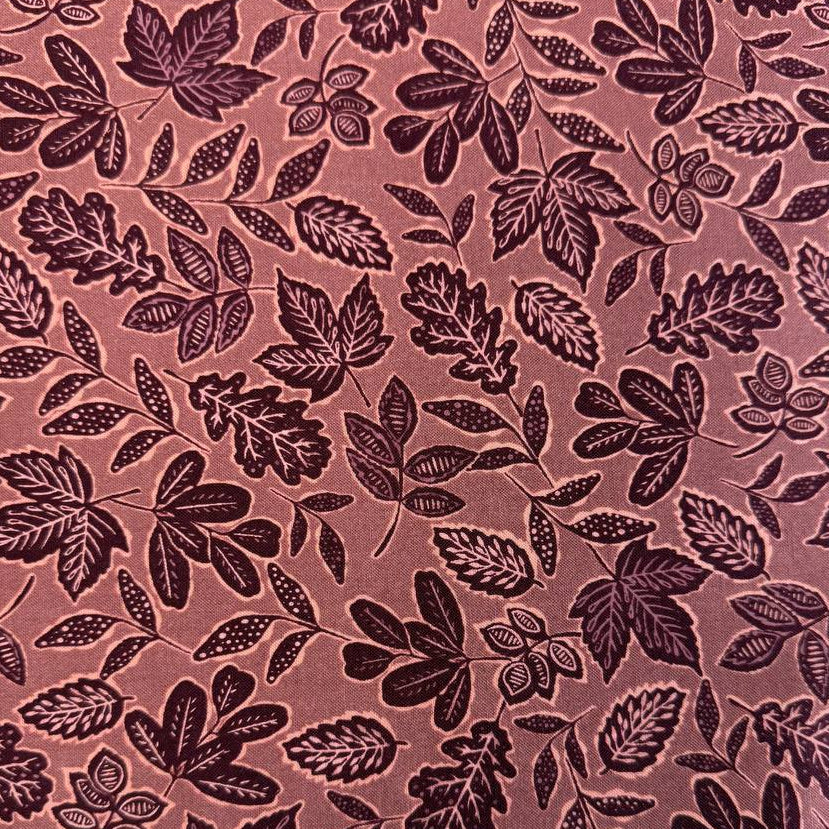 Dusty rose quilting cotton featuring an allover leaf print from Moda Fabrics' Foraged, Found & Hand Me Down collection.