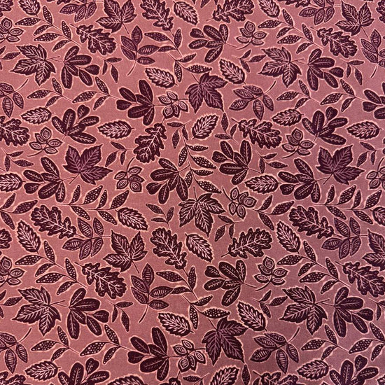 Dusty rose quilting cotton featuring an allover leaf print from Moda Fabrics' Foraged, Found & Hand Me Down collection.