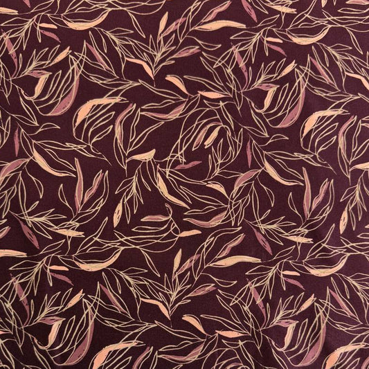 Deep plum quilting cotton featuring delicate scattered leaf silhouettes in mauve and blush tones from the Foraged, Found & Hand Me Down collection by Fancy That Design House for Moda Fabrics.