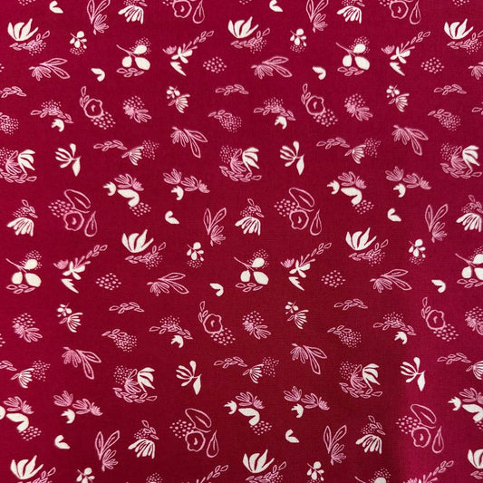 Crimson quilting cotton fabric featuring scattered cream and pink floral motifs from the Things Above collection by Stephanie Sliwinski for Moda Fabrics.