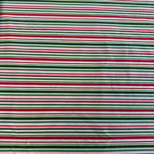 Multi-coloured striped quilting cotton fabric from Betty's Geraniums by Jackie Robinson for Benartex, available in green stripe and pink-red stripe colourways.