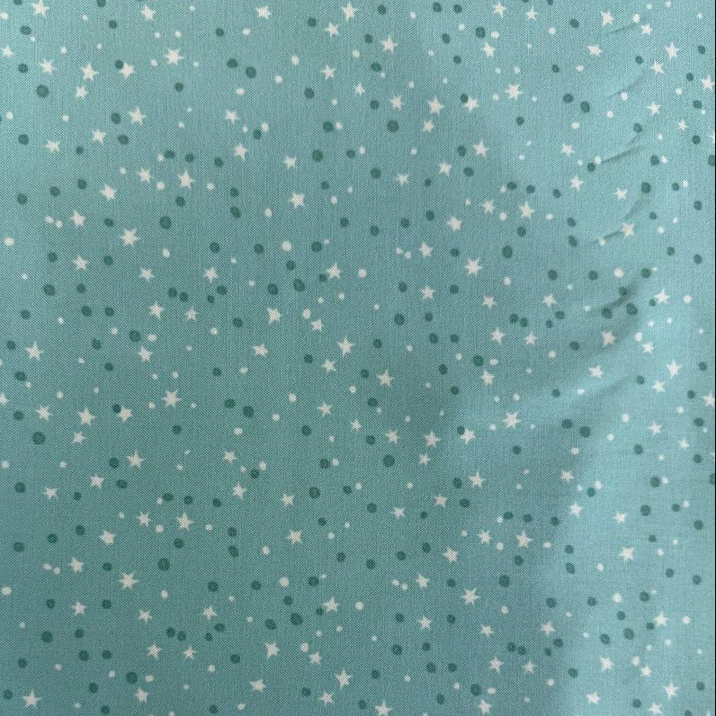 Blue quilting cotton featuring tiny white stars and scattered dots from the Blast Off collection by Stacy Iest Hsu for Moda Fabrics.