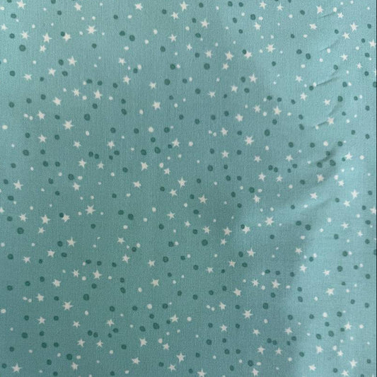 Blue quilting cotton featuring tiny white stars and scattered dots from the Blast Off collection by Stacy Iest Hsu for Moda Fabrics.