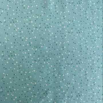 Blue quilting cotton featuring tiny white stars and scattered dots from the Blast Off collection by Stacy Iest Hsu for Moda Fabrics.