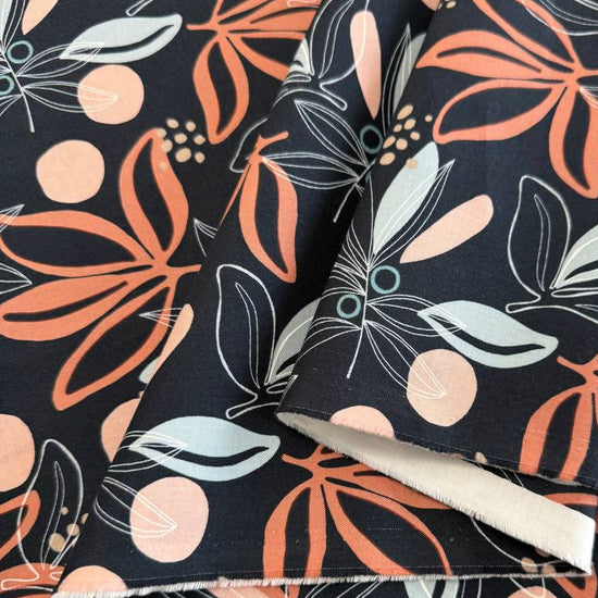 Black quilting cotton fabric featuring modern coral and blush floral and leaf motifs with pale aqua accents from the Melrose collection by Studio M for Moda Fabrics.