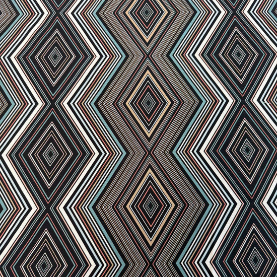Nightlife geometric quilting fabric by Studio M for Moda Fabrics featuring layered diamond patterns in black, teal, cream, blush, coral, and gold tones.