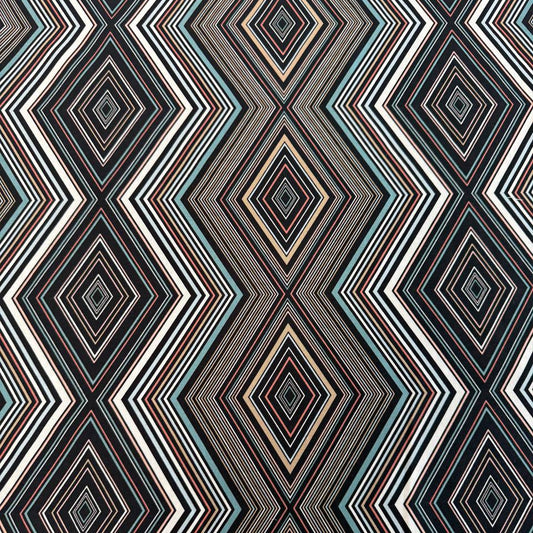 Nightlife geometric quilting fabric by Studio M for Moda Fabrics featuring layered diamond patterns in black, teal, cream, blush, coral, and gold tones.