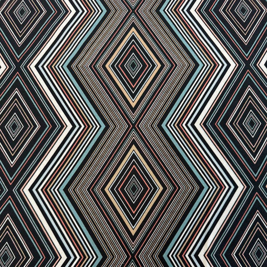 Nightlife geometric quilting fabric by Studio M for Moda Fabrics featuring layered diamond patterns in black, teal, cream, blush, coral, and gold tones.