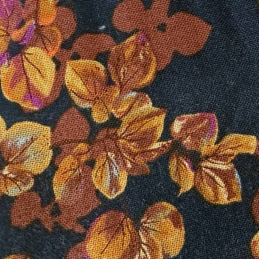 Autumn Forest Charm Pack fabric bundle by Moda Fabrics with 42 precut 5 inch cotton quilting squares in autumn floral prints on navy background