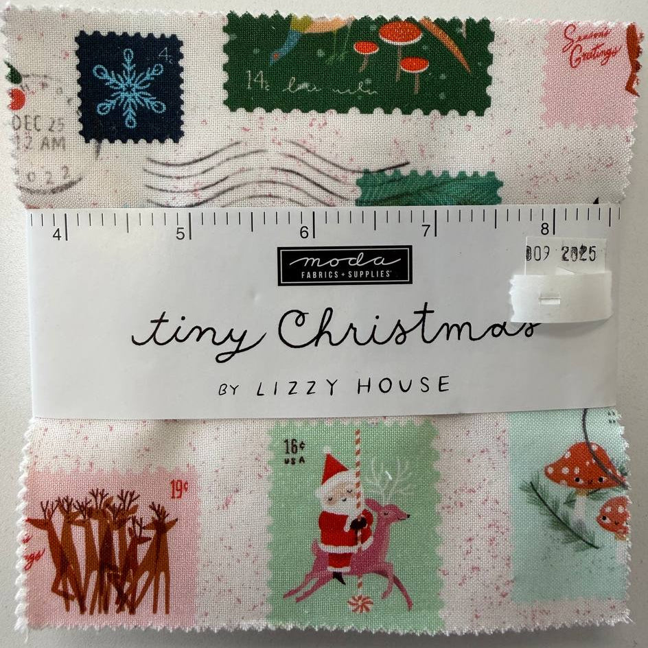 Tiny Christmas charm pack fabric bundle by Lizzy House for Moda Fabrics with 42 precut 5 inch cotton quilting squares featuring Christmas themed prints