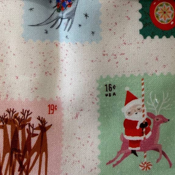 Tiny Christmas charm pack fabric bundle by Lizzy House for Moda Fabrics with 42 precut 5 inch cotton quilting squares featuring Christmas themed prints