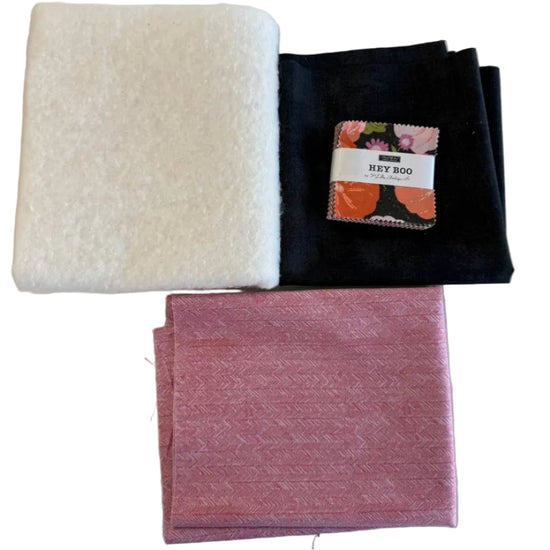 Mini Charm Hey Boo Table Runner Kit including Halloween-themed mini charm pack, coordinating black and pink fabrics, and batting for a festive quilted table runner.