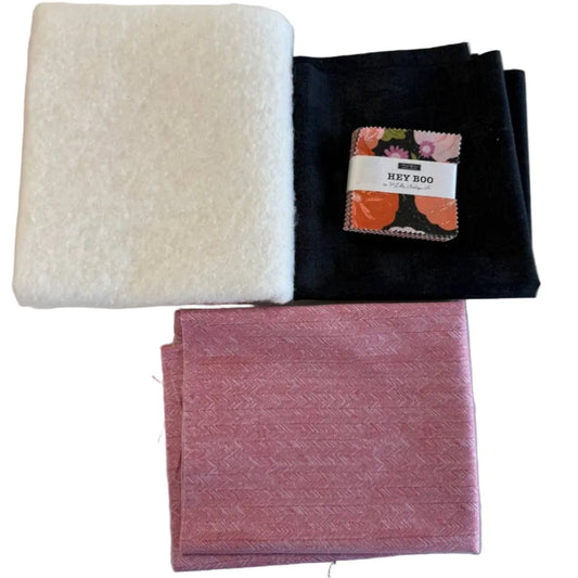 Mini Charm Hey Boo Table Runner Kit including Halloween-themed mini charm pack, coordinating black and pink fabrics, and batting for a festive quilted table runner.