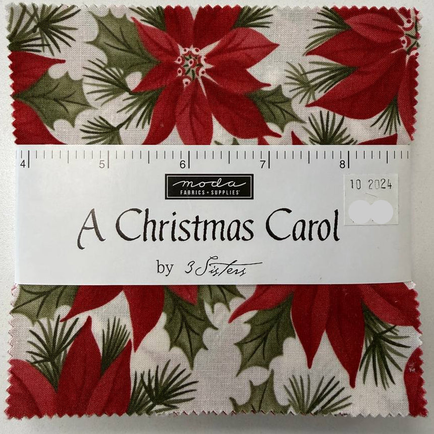 A Christmas Carol Charm Pack by 3 Sisters for Moda Fabrics featuring red poinsettia Christmas quilting cotton prints