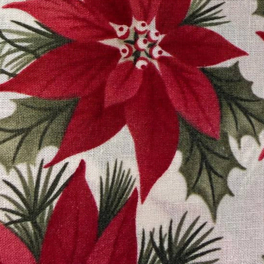 A Christmas Carol Charm Pack by 3 Sisters for Moda Fabrics featuring red poinsettia Christmas quilting cotton prints