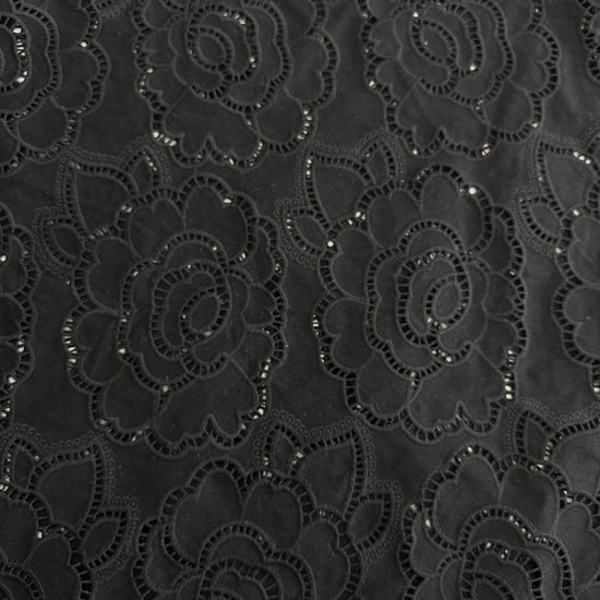 Black cut out lace fabric with floral eyelet pattern