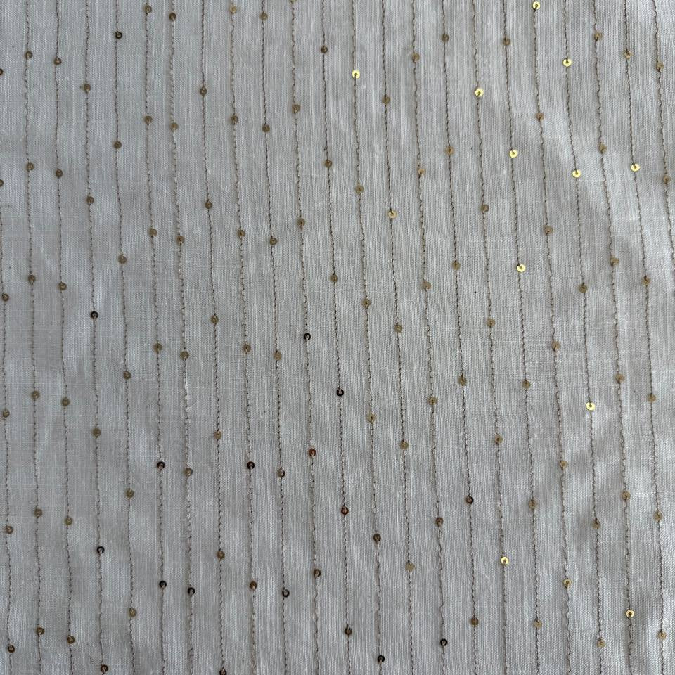 White linen blend fabric with vertical gold sequin lines
