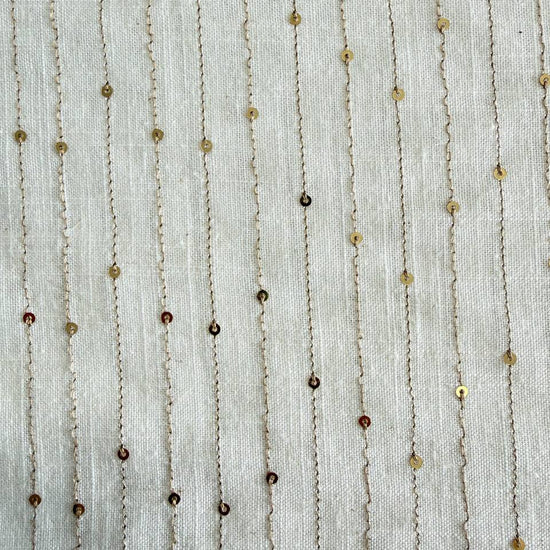 White linen blend fabric with vertical gold sequin lines
