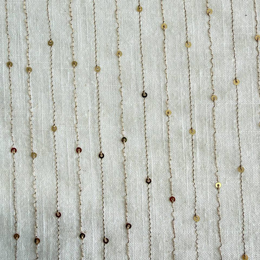 White linen blend fabric with vertical gold sequin lines