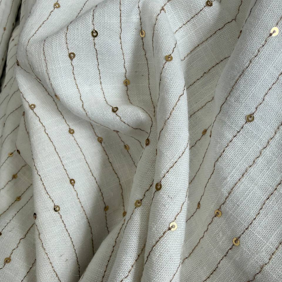 Natural linen blend fabric with vertical gold sequin lines