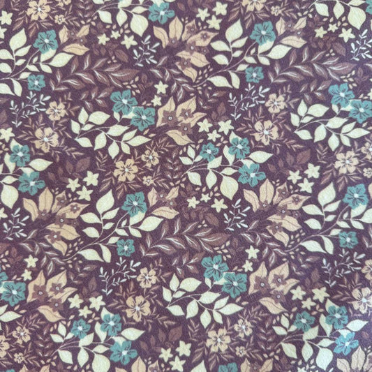 Quilted cotton jersey fabric with floral print in brown and turquoise tones