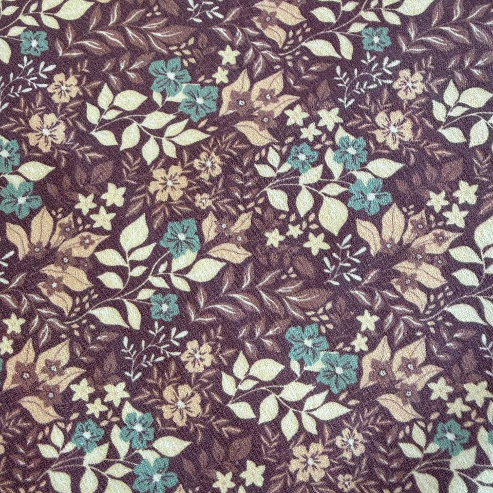 Quilted cotton jersey fabric with floral print in brown and turquoise tones
