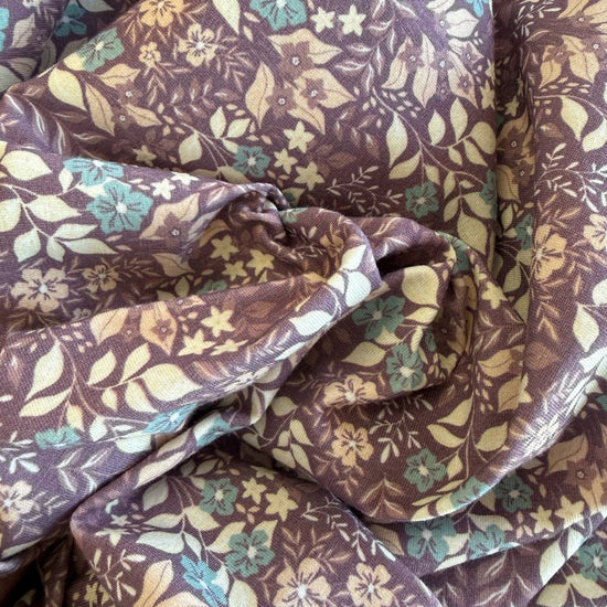 Quilted cotton jersey fabric with floral print in brown and turquoise tones