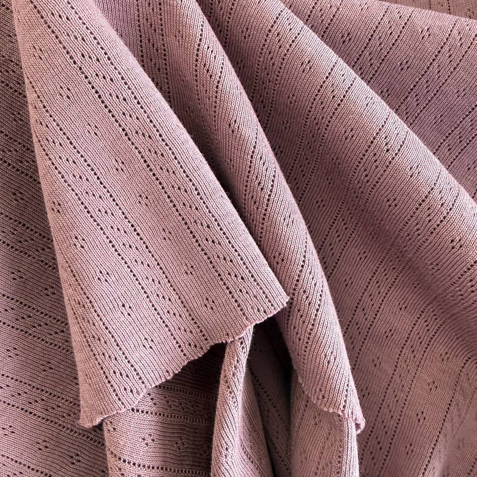 Delicate pointelle knit fabrics with soft textured pattern