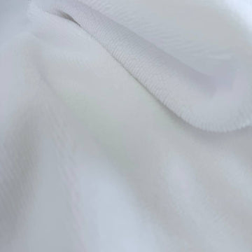 Soft white bamboo terry fabric texture close-up plush absorbent surface
