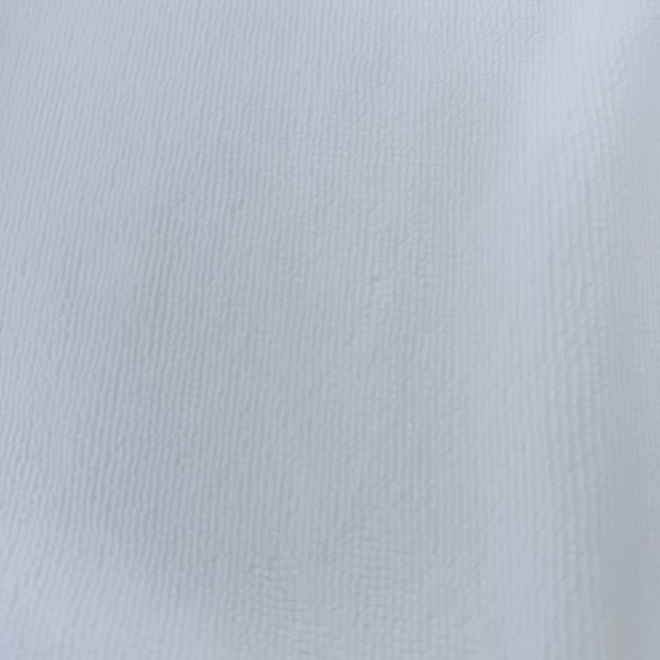 Soft white bamboo terry fabric texture close-up plush absorbent surface
