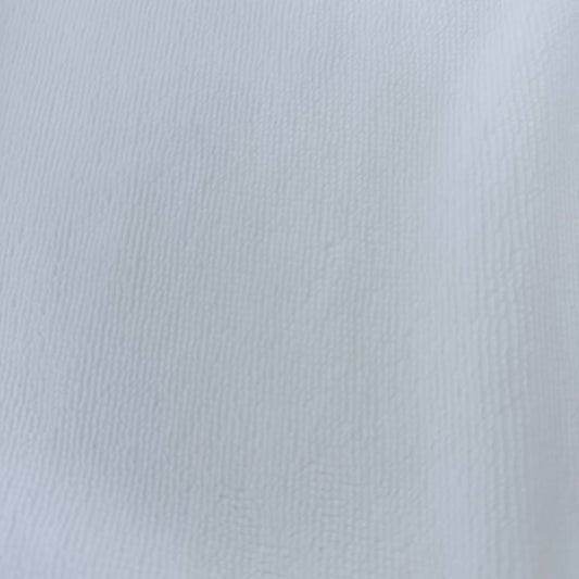 Soft white bamboo terry fabric texture close-up plush absorbent surface