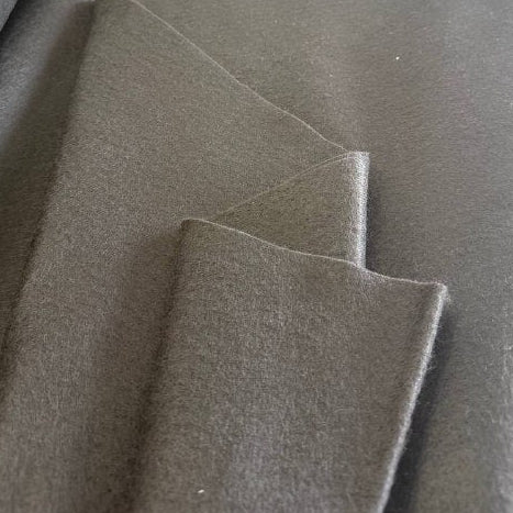 Black felt fabric texture close-up