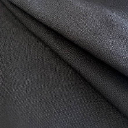 Black heavy cotton canvas fabric close-up texture, durable thick woven material for bags and upholstery