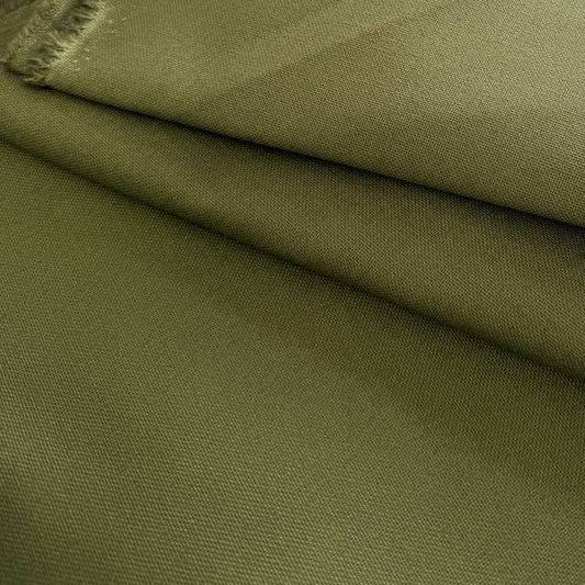 Heavy khaki cotton canvas fabric folded, textured durable material