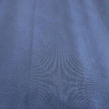 Heavy canvas fabric in denim blue color close-up texture