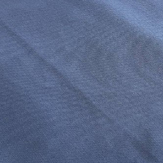 Heavy canvas fabric in denim blue color close-up texture