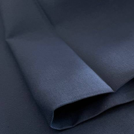 Heavy canvas fabric in denim blue color close-up texture