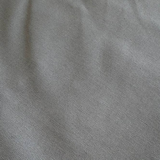 Heavy steel grey canvas fabric roll with visible texture