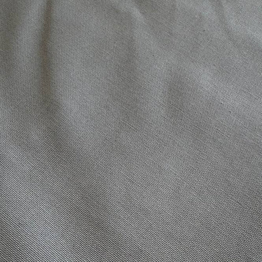 Heavy steel grey canvas fabric roll with visible texture