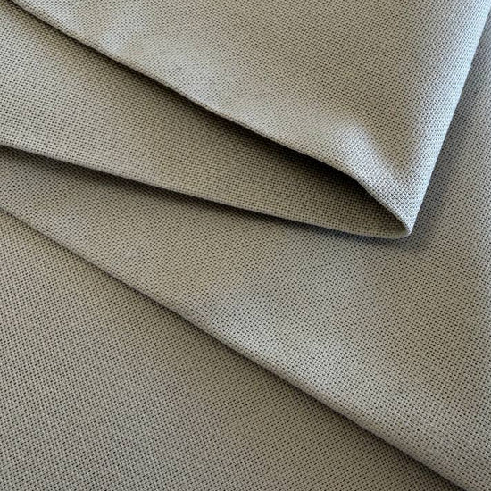 Close-up texture of beige cotton canvas fabric