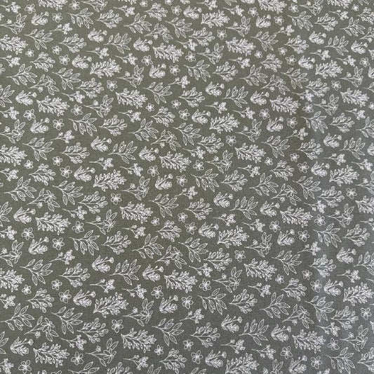 Green cotton fabric with small white botanical floral print, soft quilting cotton texture